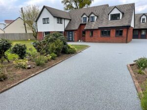 grey resin leading to redbrick house